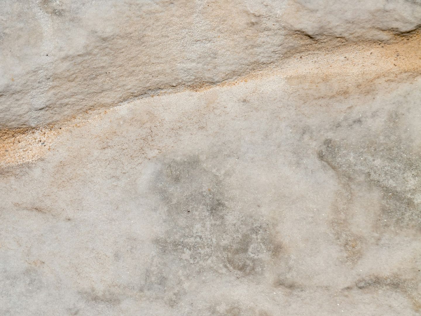 Light grey stone with a horizontal ridge.
