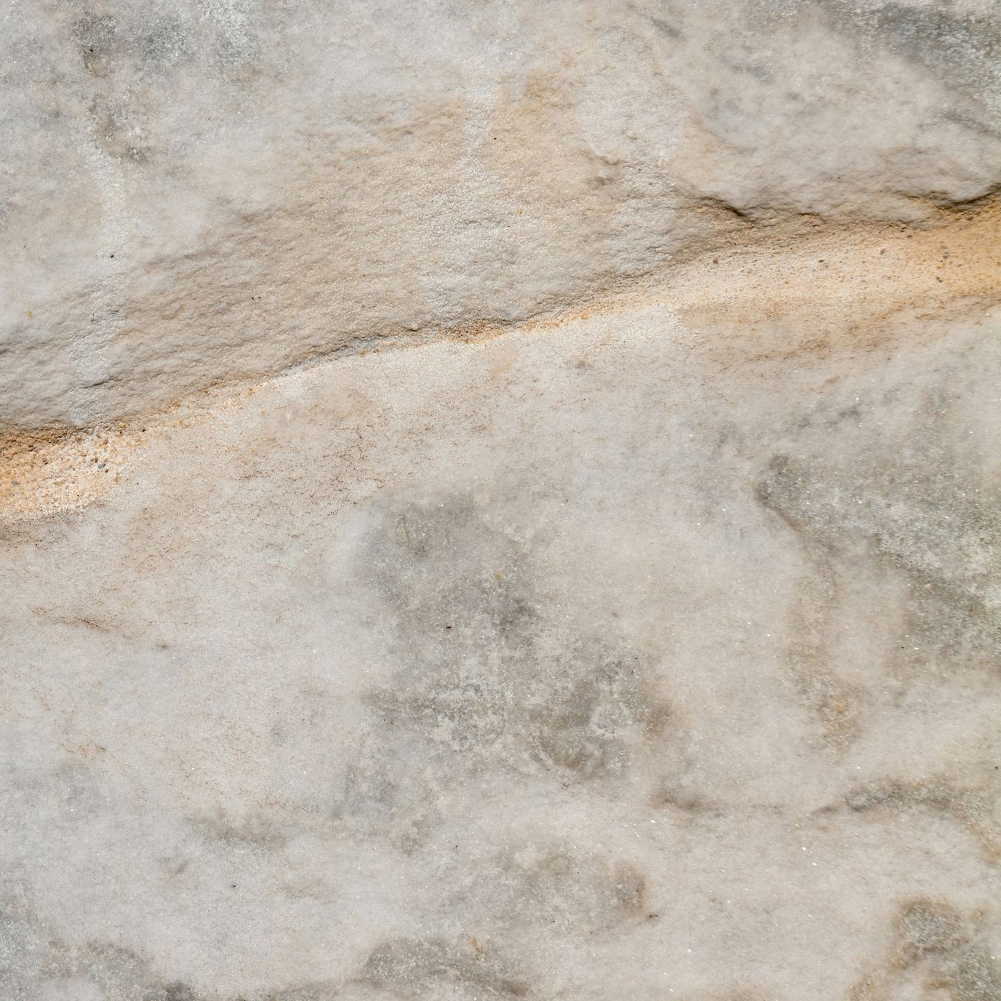 Light grey stone with a horizontal ridge.