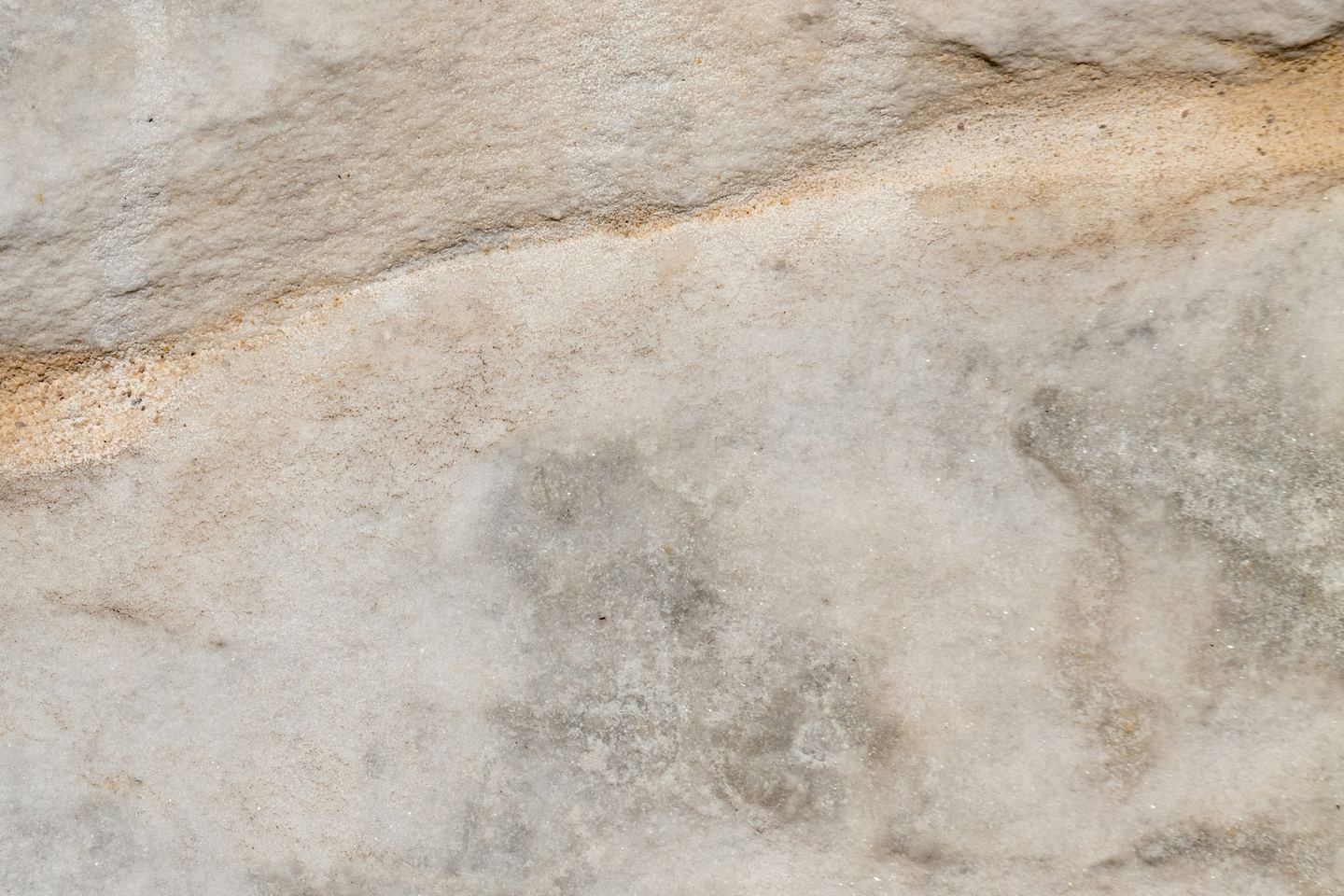 Light grey stone with a horizontal ridge.